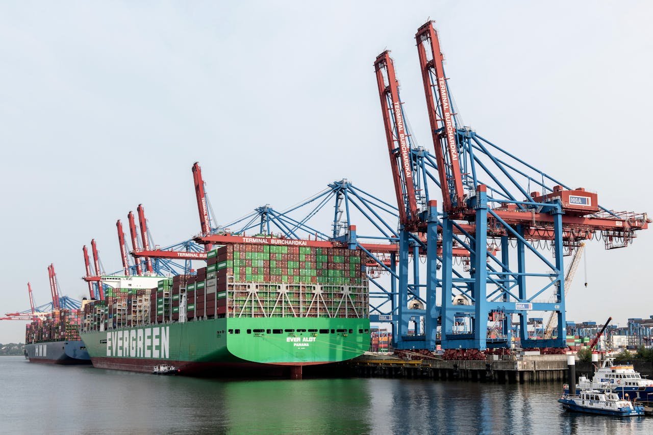 Port cranes loading shipping containers onto vessels
